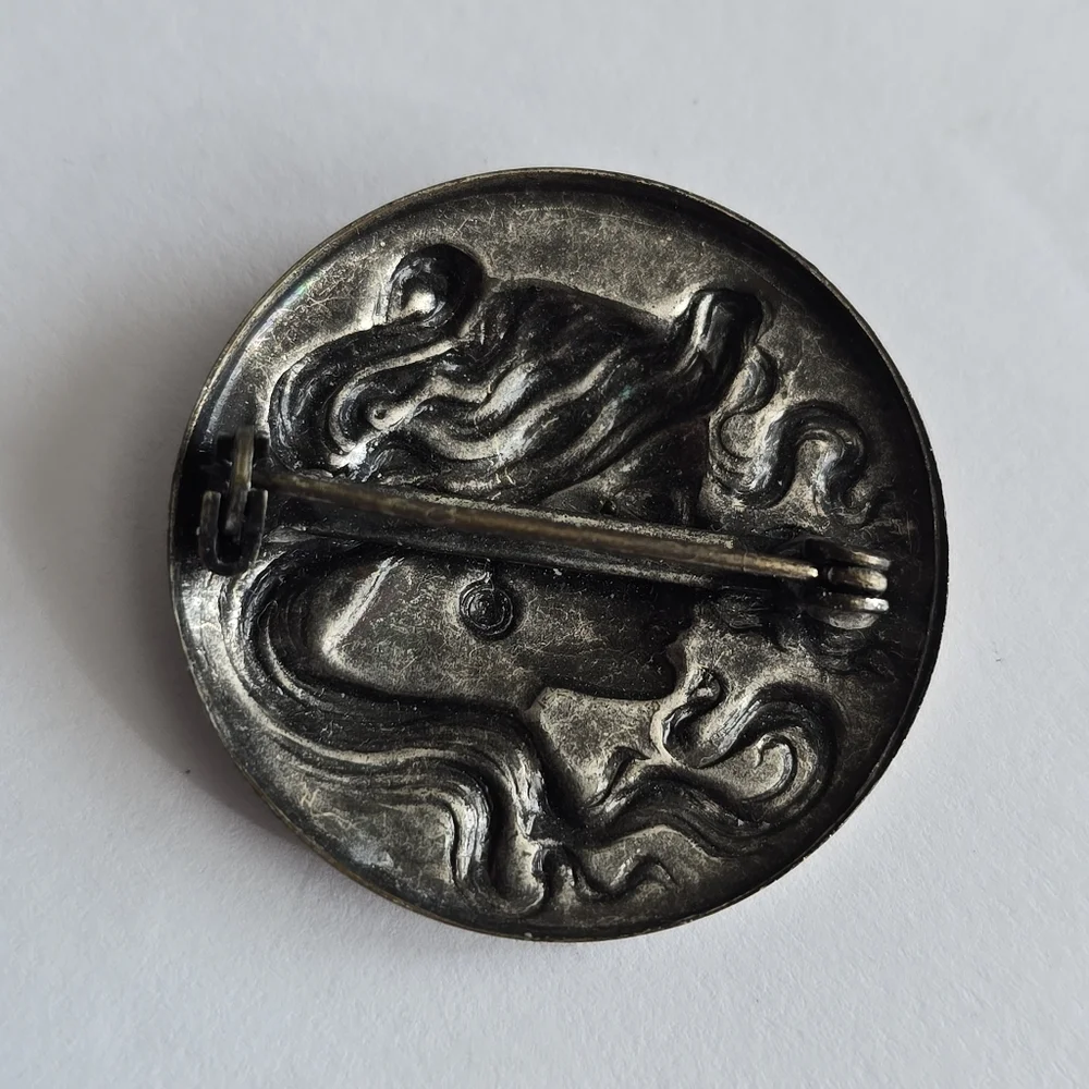 Art Nouveau style brooch woman with flowing hair dark silver tone pin